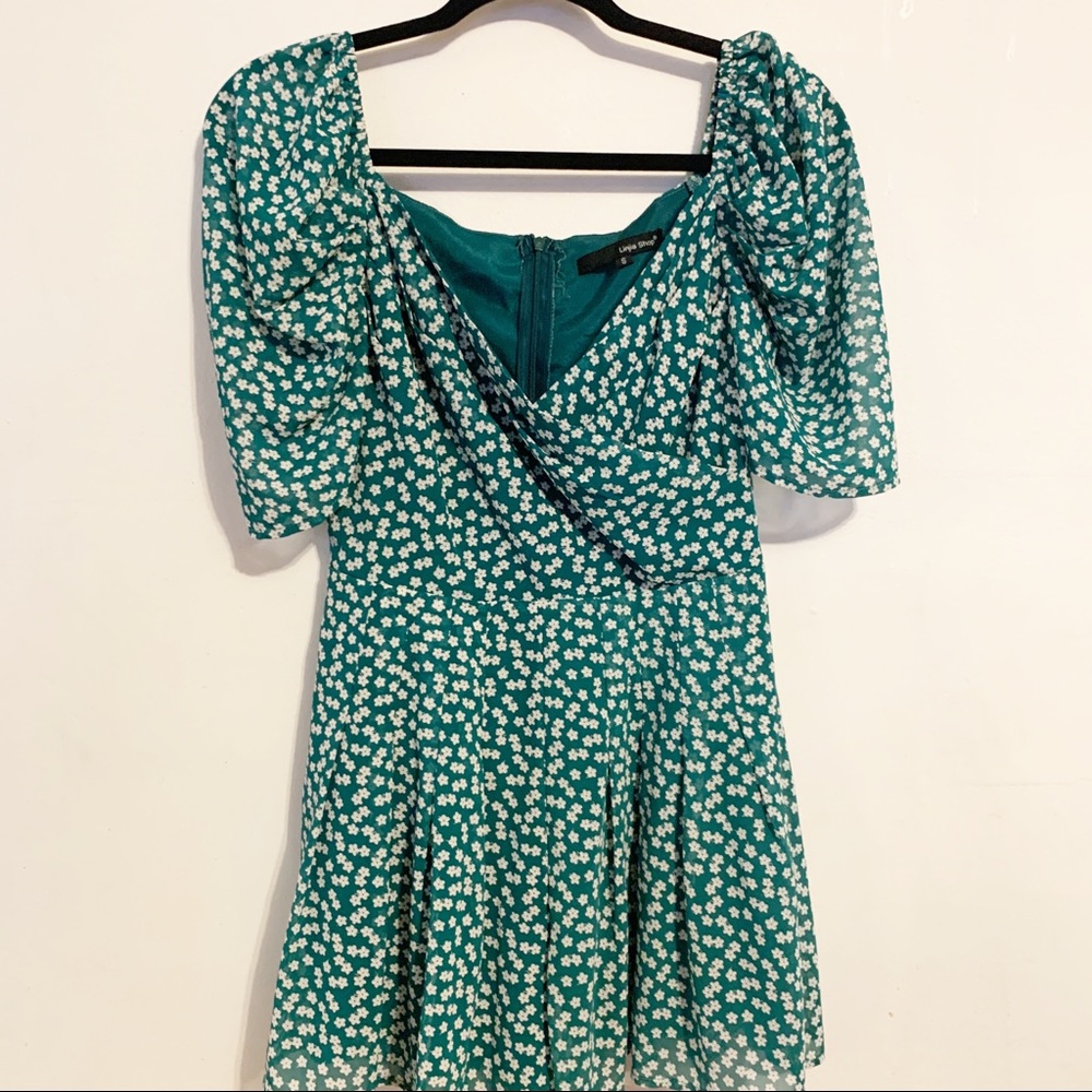GREEN FLORAL ROMPER SIZE SMALL